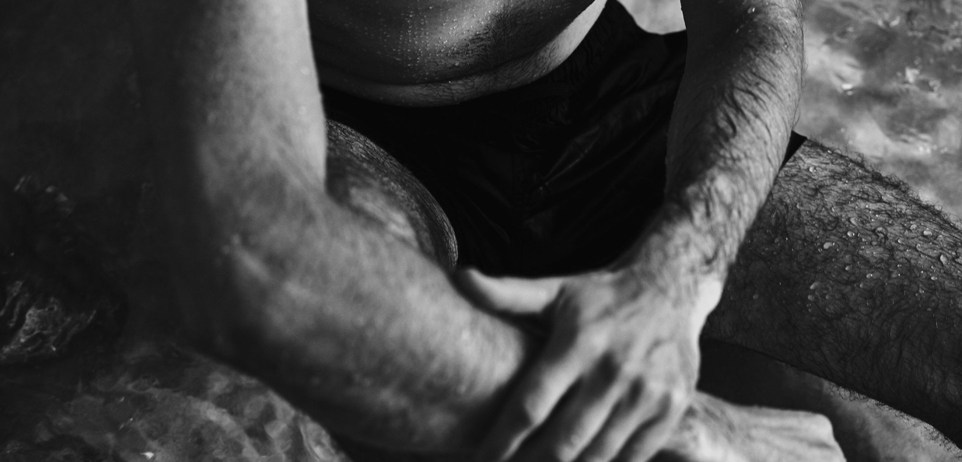 A man relaxing in the hydrotherapy pool at BASIN Glacial Waters